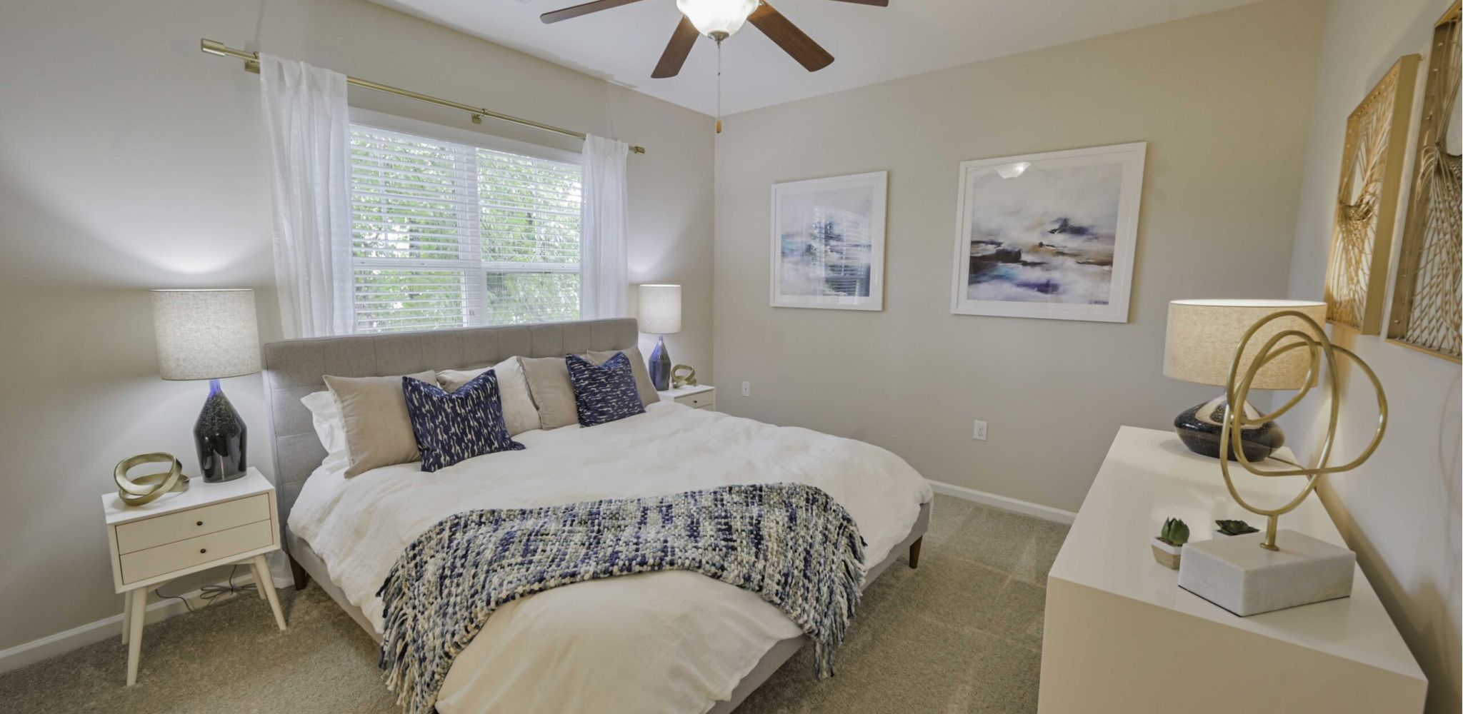 Hawthorne at Murrayville apartment bedroom with carpet flooring, bedside tables, and bed
